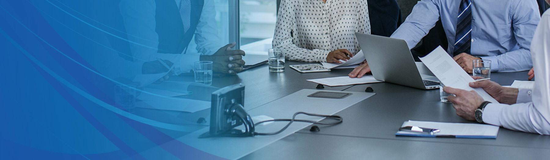 Team members sitting around a conference table