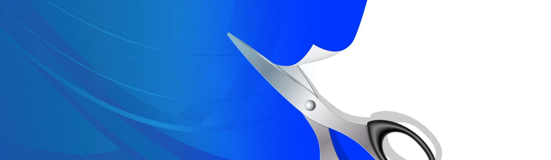 Scissors cutting paper on an angle.