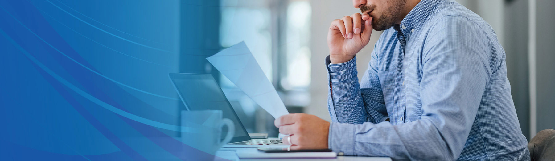 Man looking over a document