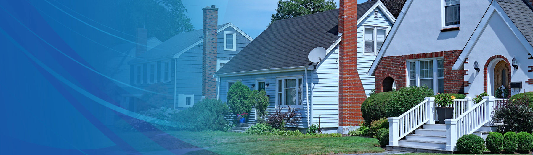 Three attractive homes on a street in a neighborhood