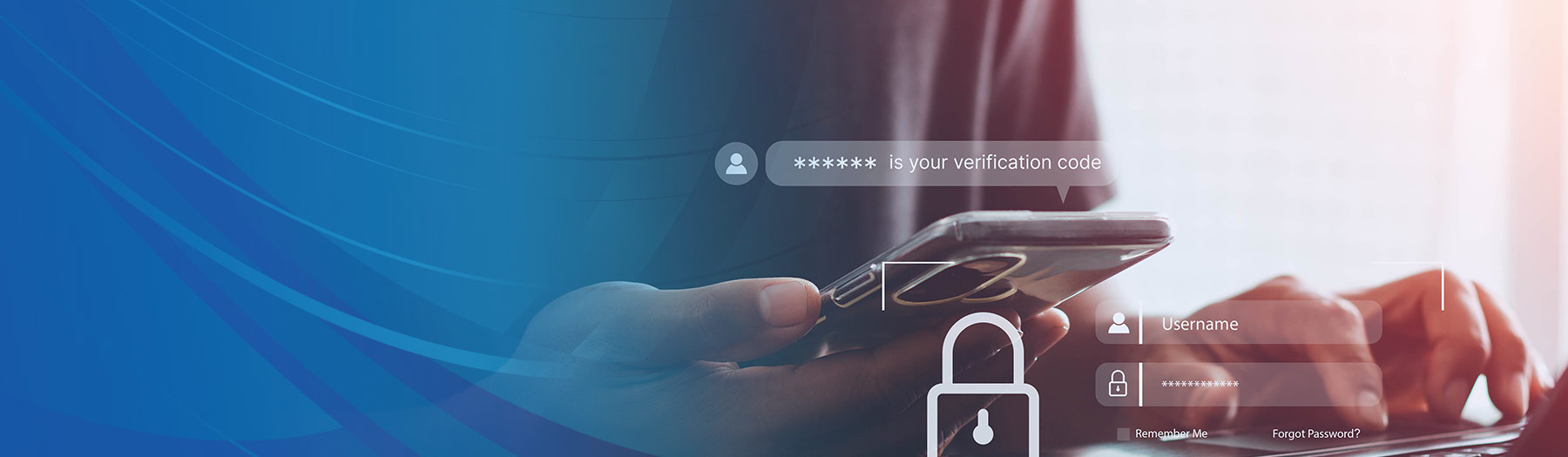 Man sitting at computer receives verification code on mobile phone